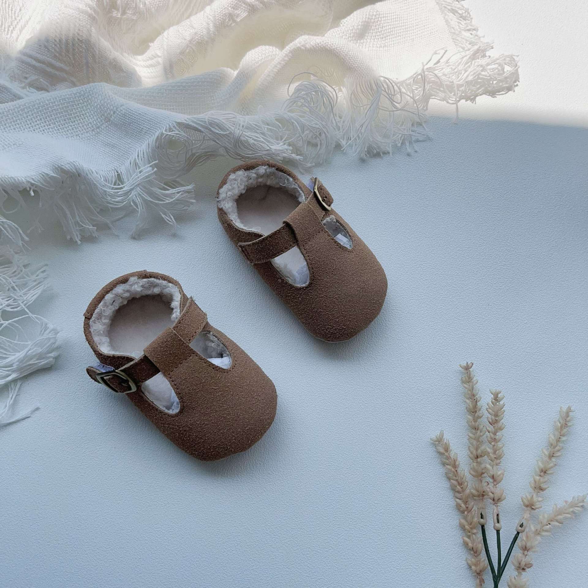 New Arrival Winter Baby Girl Solid Color Plush Warm Anti-Slip Shoes in green, grey, and brown, showcasing their soft material and anti-slip sole.