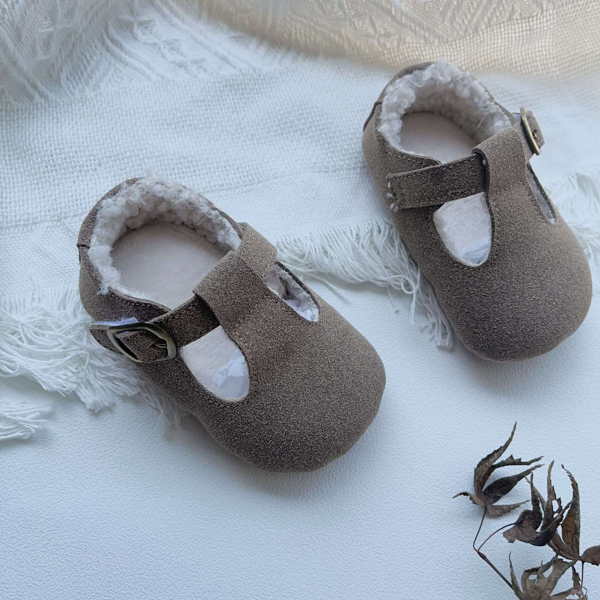 New Arrival Winter Baby Girl Solid Color Plush Warm Anti-Slip Shoes in green, grey, and brown, showcasing their soft material and anti-slip sole.