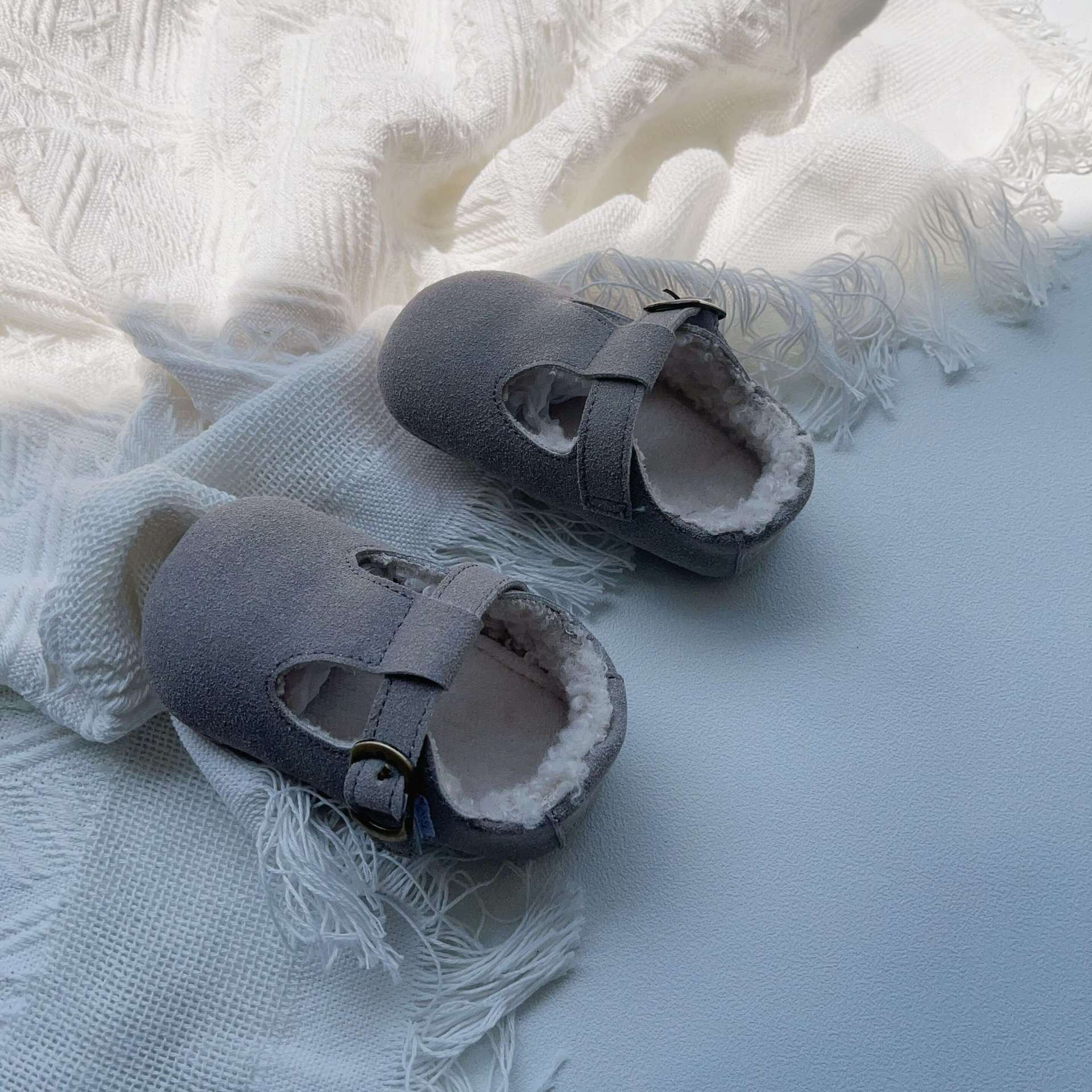 New Arrival Winter Baby Girl Solid Color Plush Warm Anti-Slip Shoes in green, grey, and brown, showcasing their soft material and anti-slip sole.