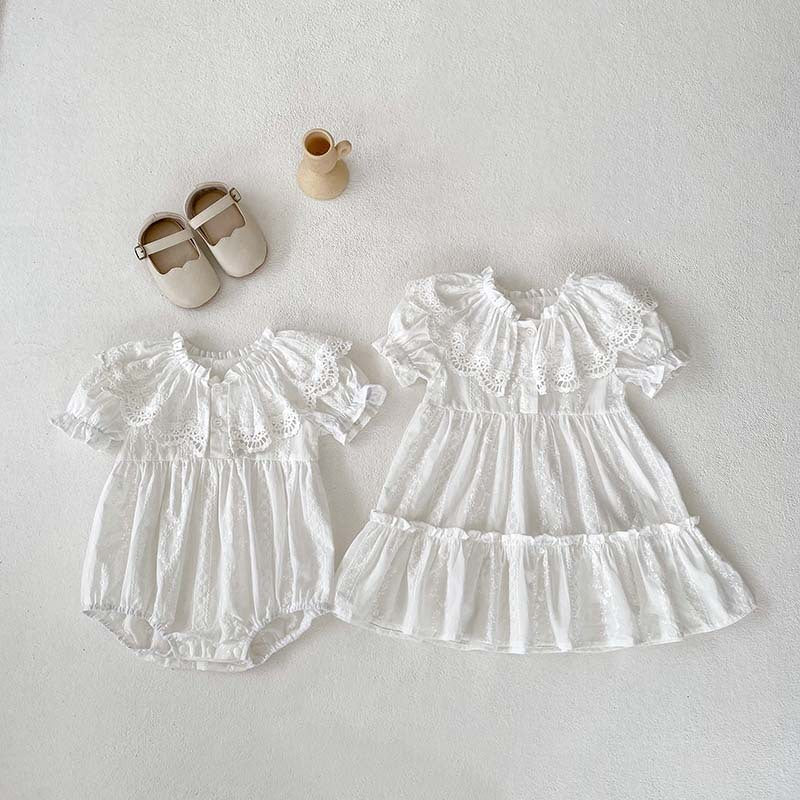 A stylish summer outfit for baby girls featuring a hollow out collar and short sleeves in beige and apricot colors.