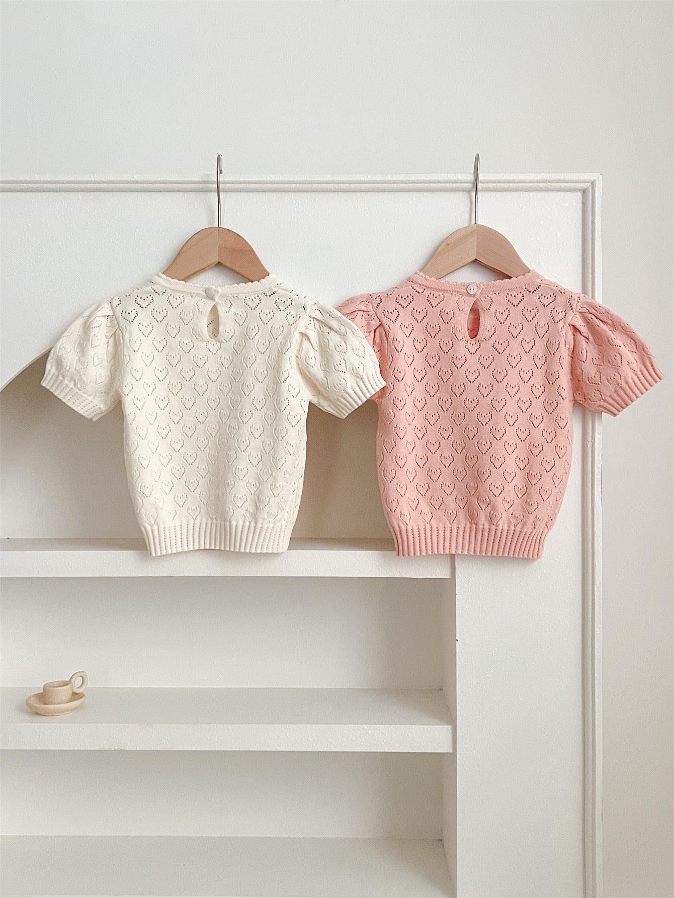 Summer baby girls knit hollow out heart pattern short in pink and beige, made from soft cotton, perfect for warm weather.