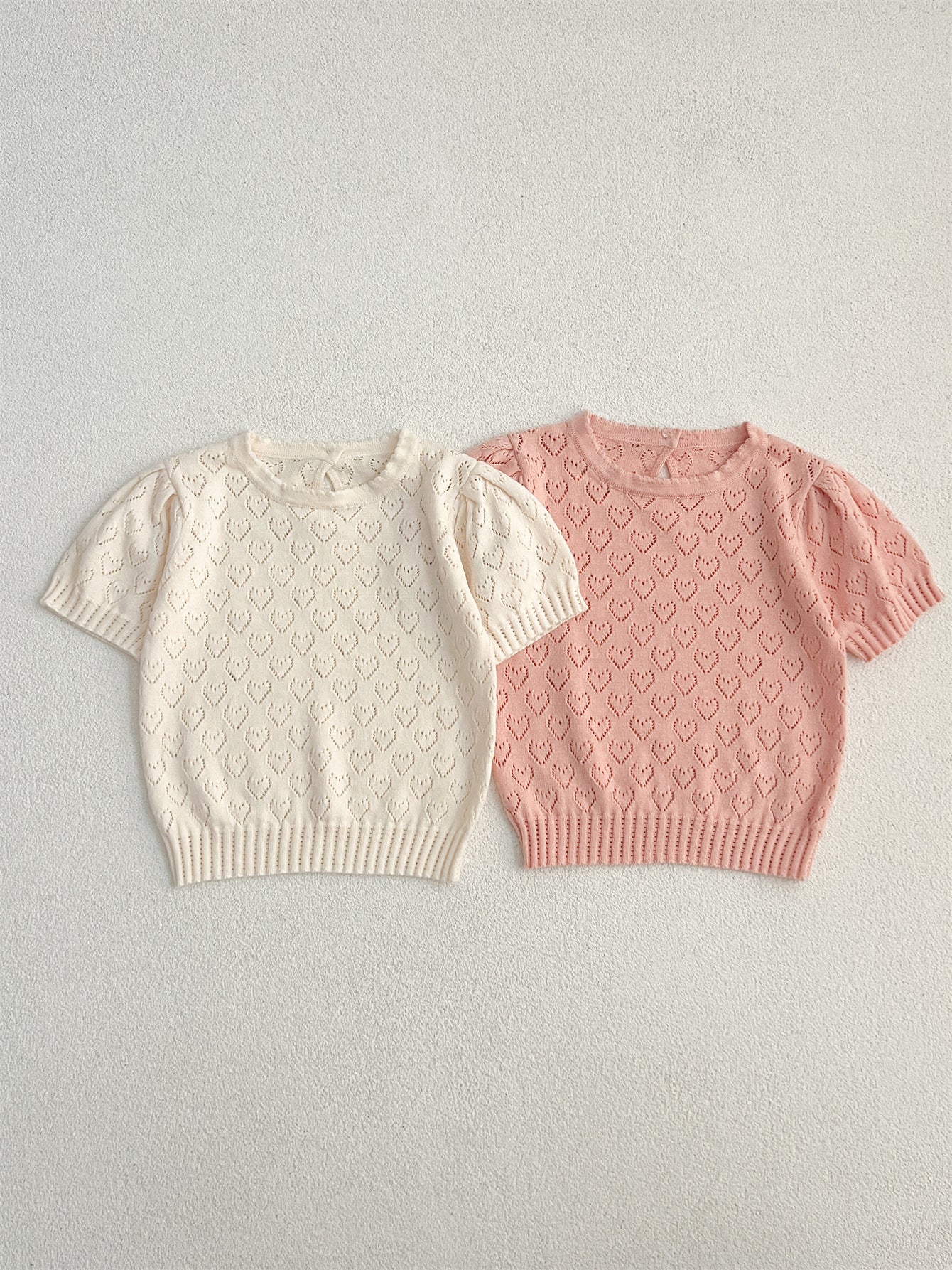 Summer baby girls knit hollow out heart pattern short in pink and beige, made from soft cotton, perfect for warm weather.