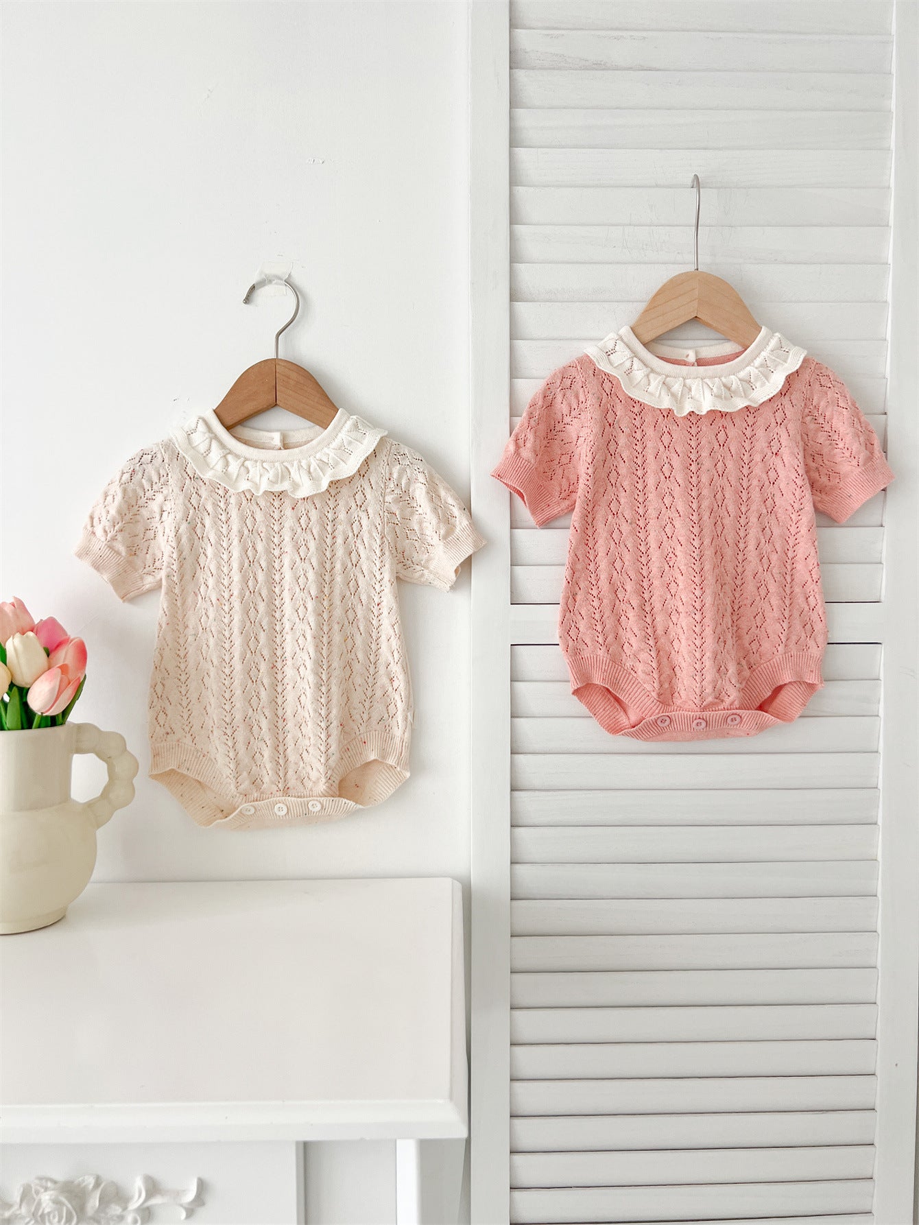 New Arrival Summer Baby Kids Girls Knitted Ruffled Collar Hollow Out dress in pink and beige, featuring a stylish ruffled collar and hollow-out design.