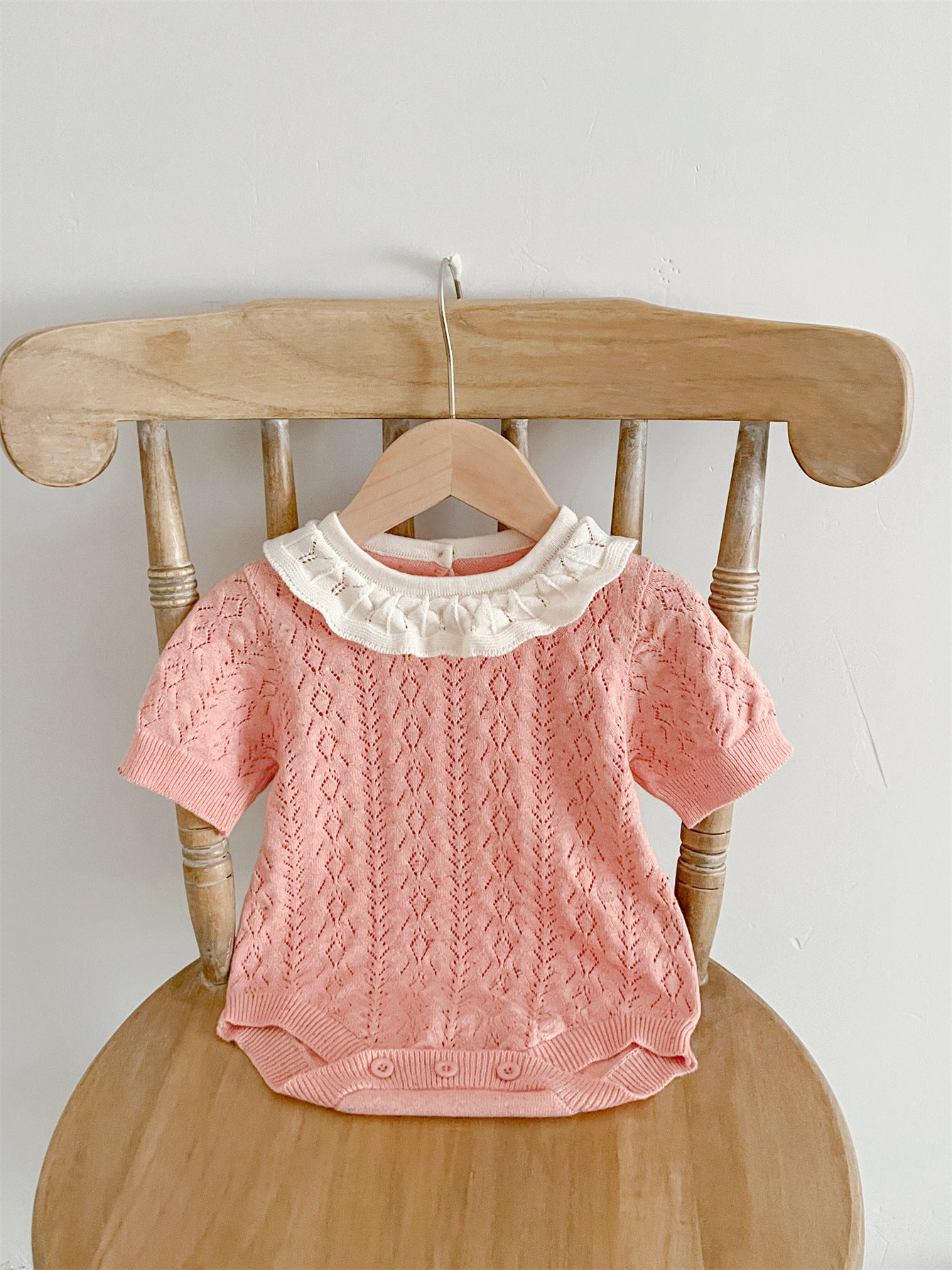 New Arrival Summer Baby Kids Girls Knitted Ruffled Collar Hollow Out dress in pink and beige, featuring a stylish ruffled collar and hollow-out design.