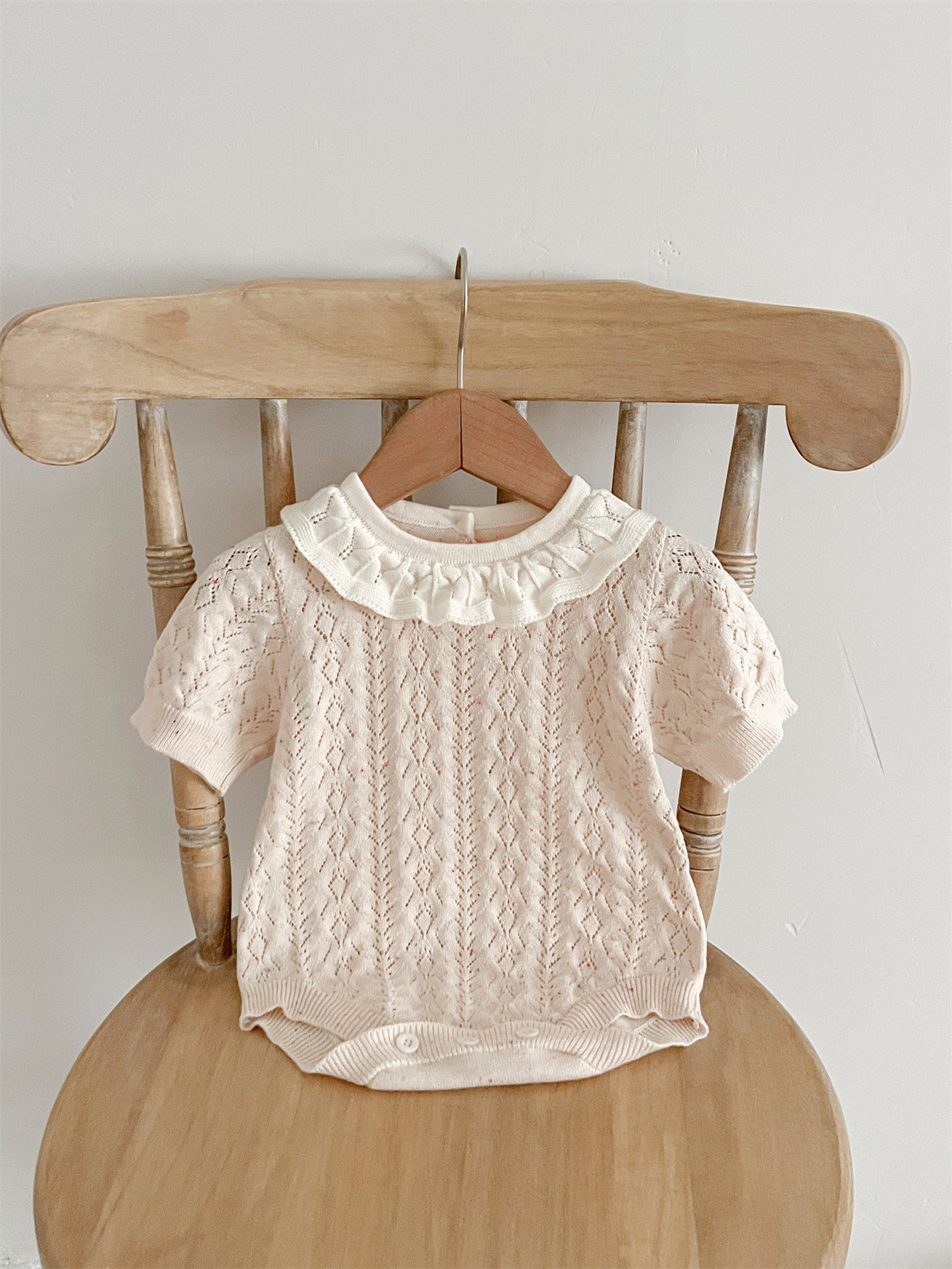 New Arrival Summer Baby Kids Girls Knitted Ruffled Collar Hollow Out dress in pink and beige, featuring a stylish ruffled collar and hollow-out design.