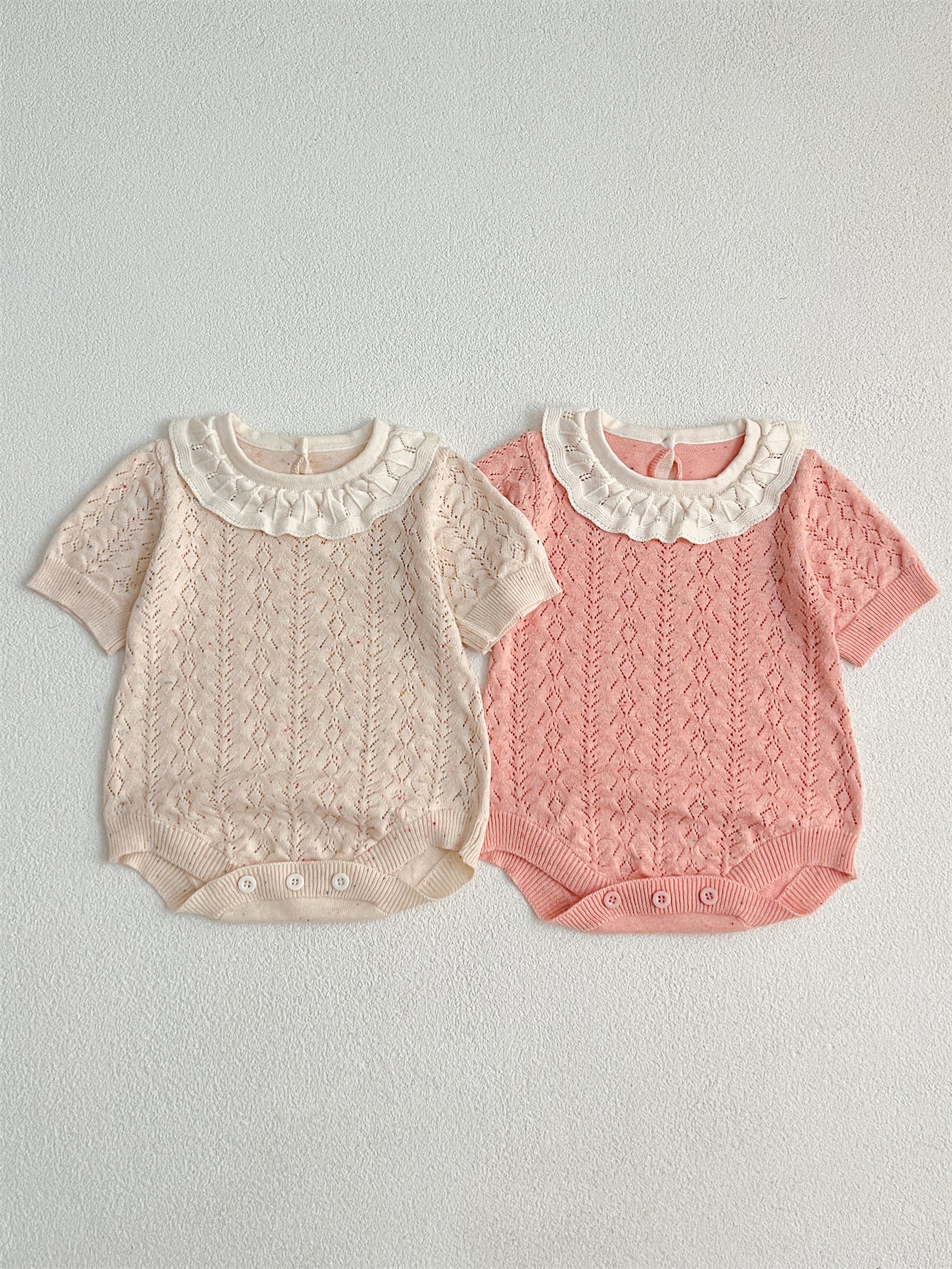 New Arrival Summer Baby Kids Girls Knitted Ruffled Collar Hollow Out dress in pink and beige, featuring a stylish ruffled collar and hollow-out design.