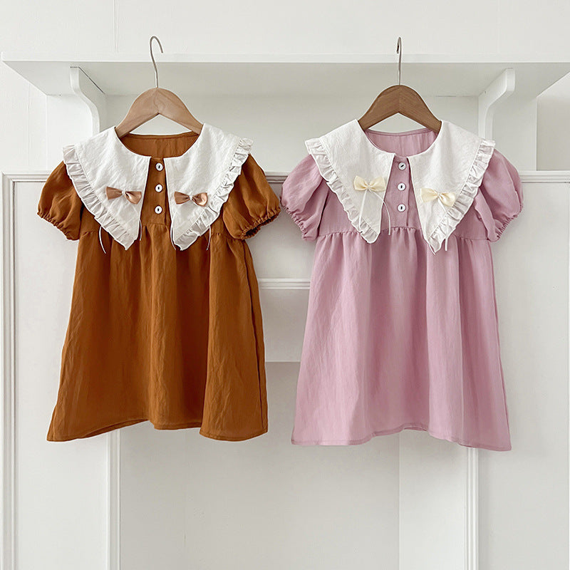 A stylish summer outfit for girls featuring a vintage countryside design with a double-bow collar in pink and brown colors.