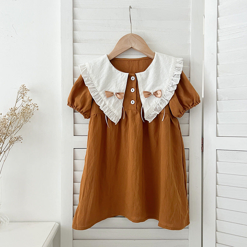 A stylish summer outfit for girls featuring a vintage countryside design with a double-bow collar in pink and brown colors.