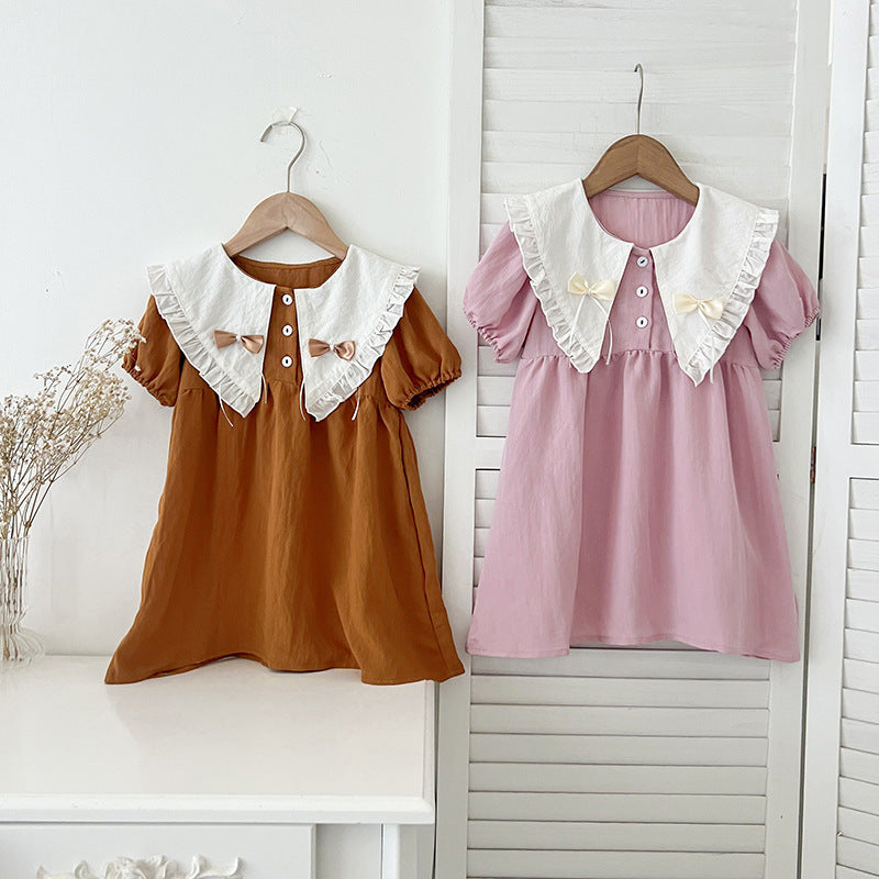 A stylish summer outfit for girls featuring a vintage countryside design with a double-bow collar in pink and brown colors.