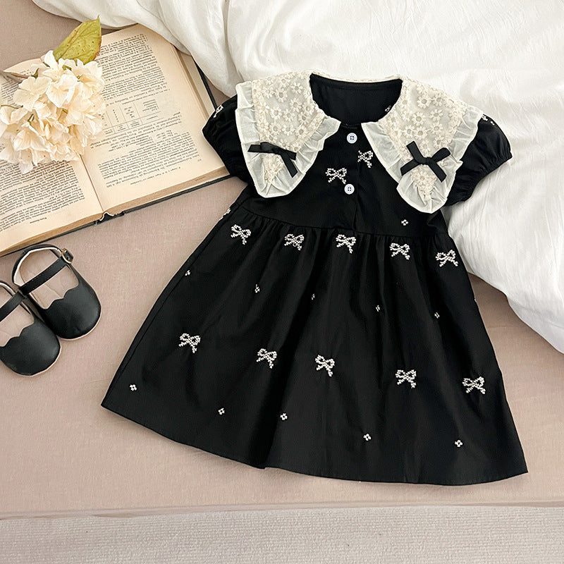 A cute summer dress for baby girls featuring a floral pattern and collar, available in black and apricot colors.