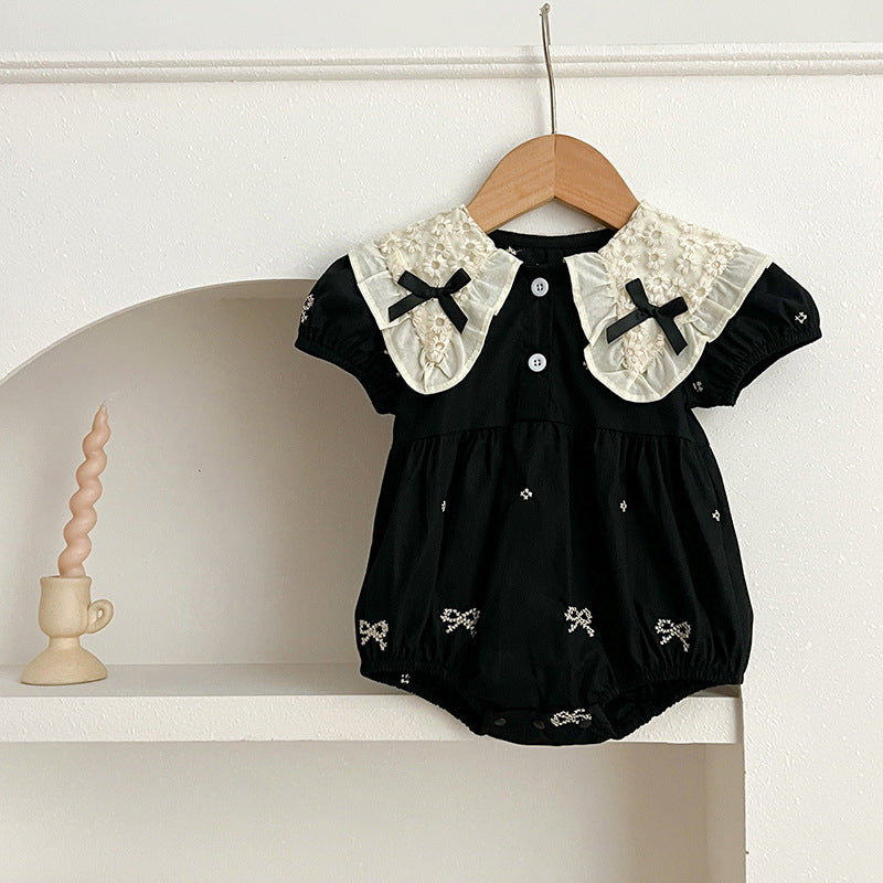 A cute summer dress for baby girls featuring a floral pattern and collar, available in black and apricot colors.