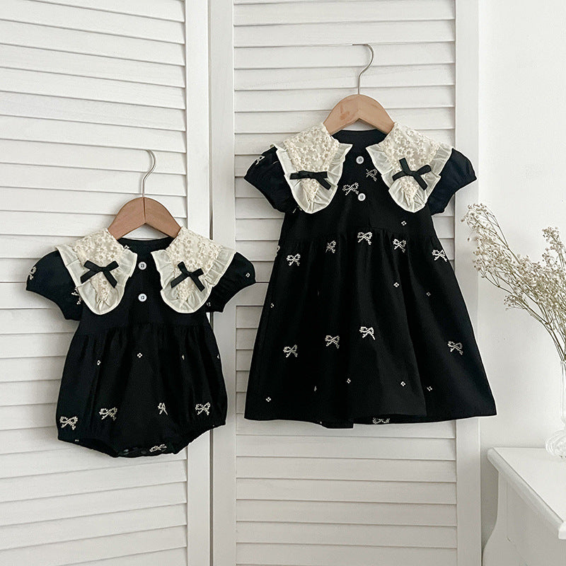 A cute summer dress for baby girls featuring a floral pattern and collar, available in black and apricot colors.