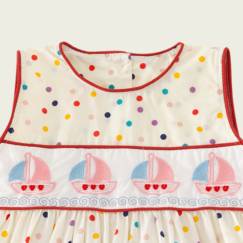 A cute summer outfit for girls featuring colorful dots and sailing boats design in beige color, made from soft cotton fabric.