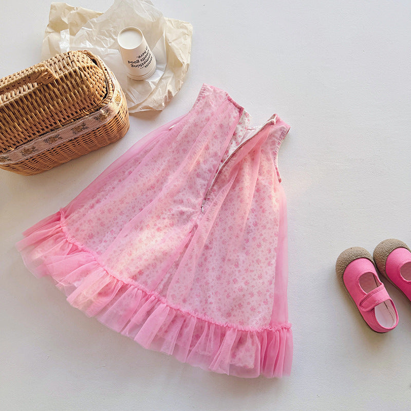 A cute summer dress for girls featuring a floral print, sleeveless design, and lightweight mesh fabric in pink color.