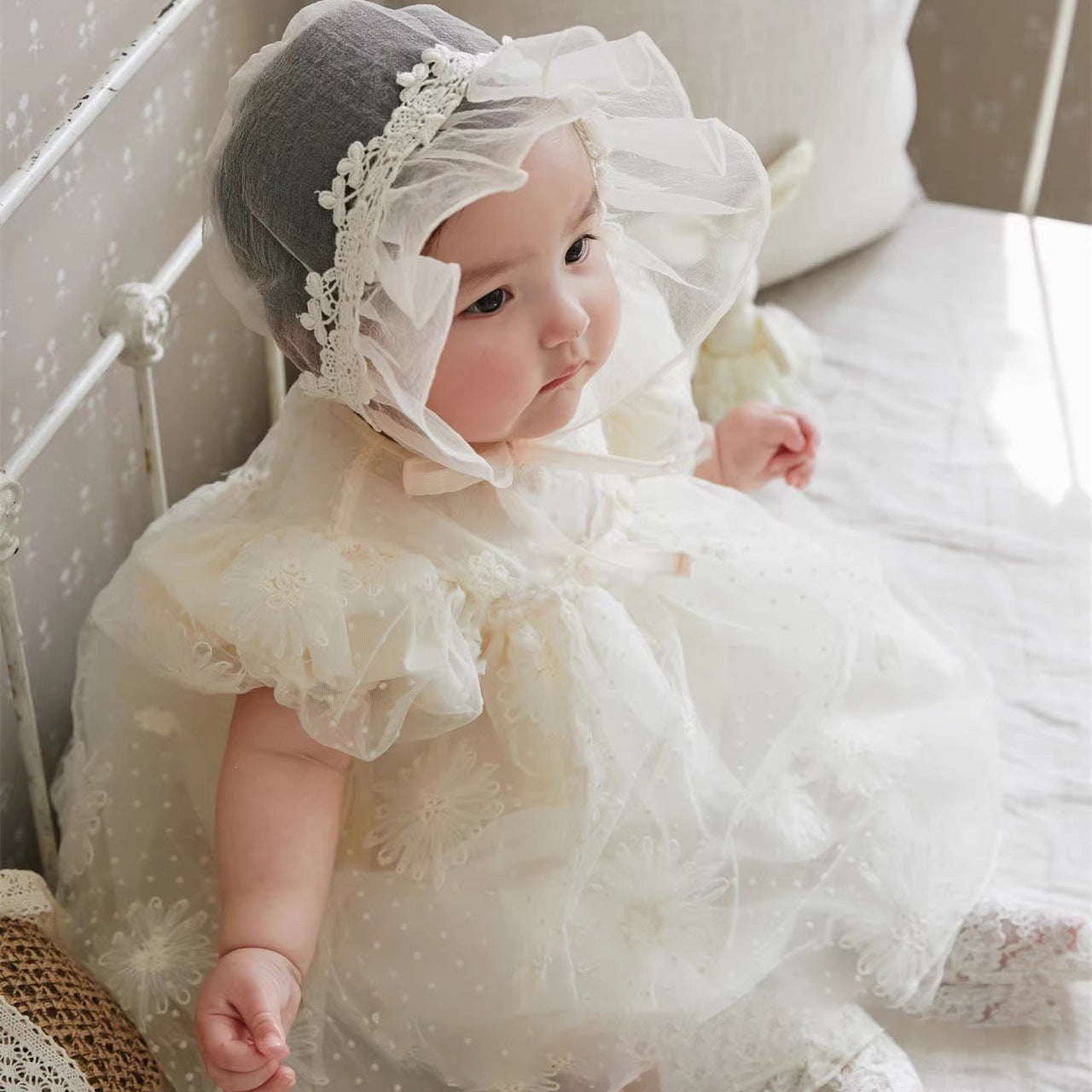 A beautiful beige summer dress for girls featuring floral embroidery and mesh details, perfect for warm weather occasions.