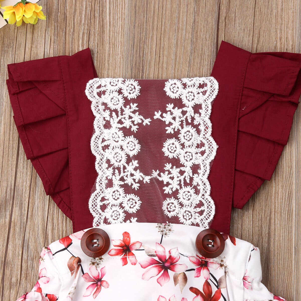 Red floral dress with lace detailing.