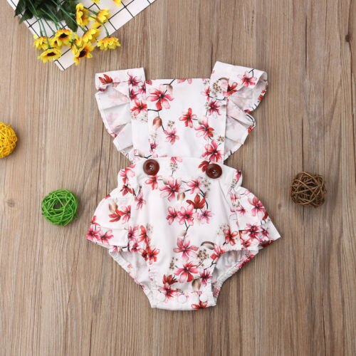 Floral baby romper with ruffles.