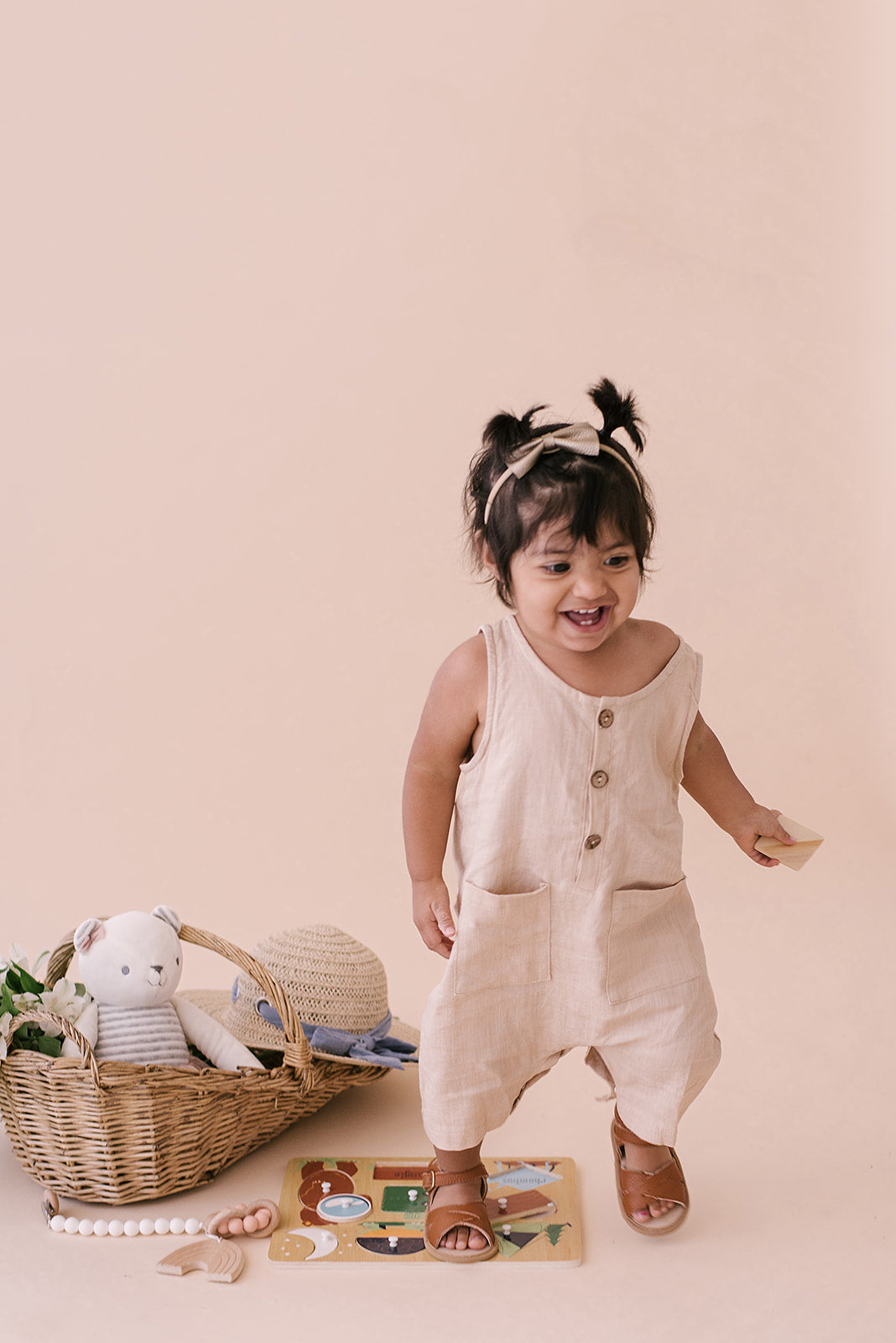 Oatmeal Cropped Linen Baby Romper featuring soft linen fabric and diaper snaps, perfect for stylish summer wear.