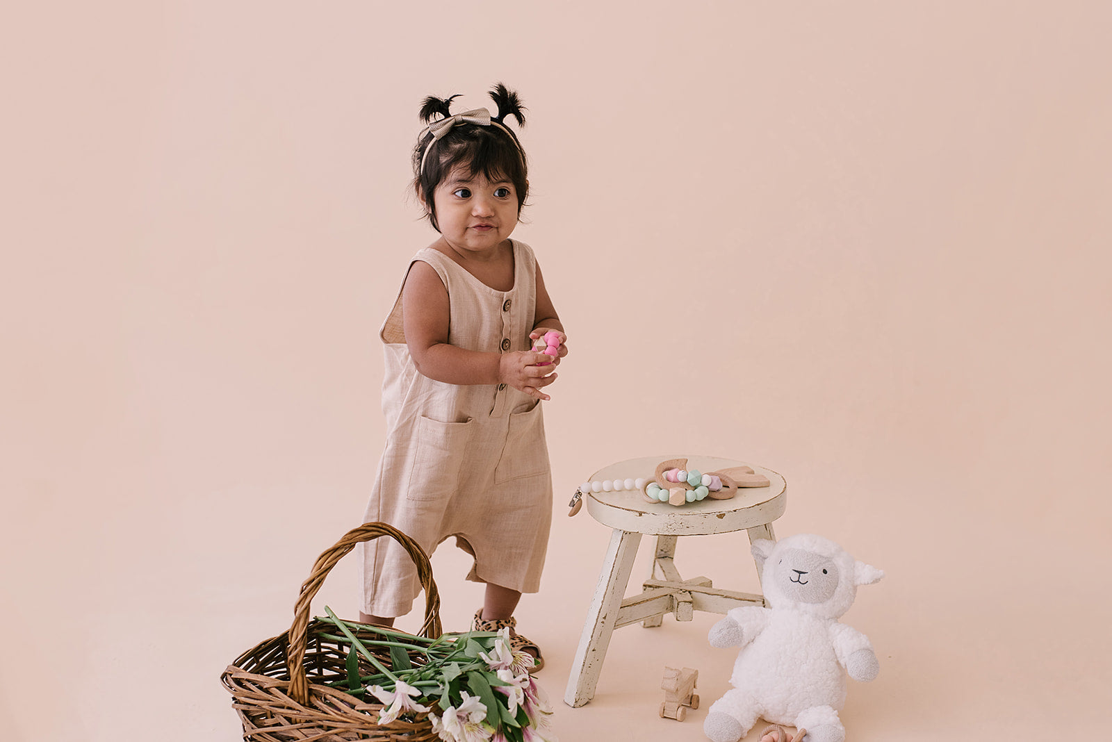 Oatmeal Cropped Linen Baby Romper featuring soft linen fabric and diaper snaps, perfect for stylish summer wear.