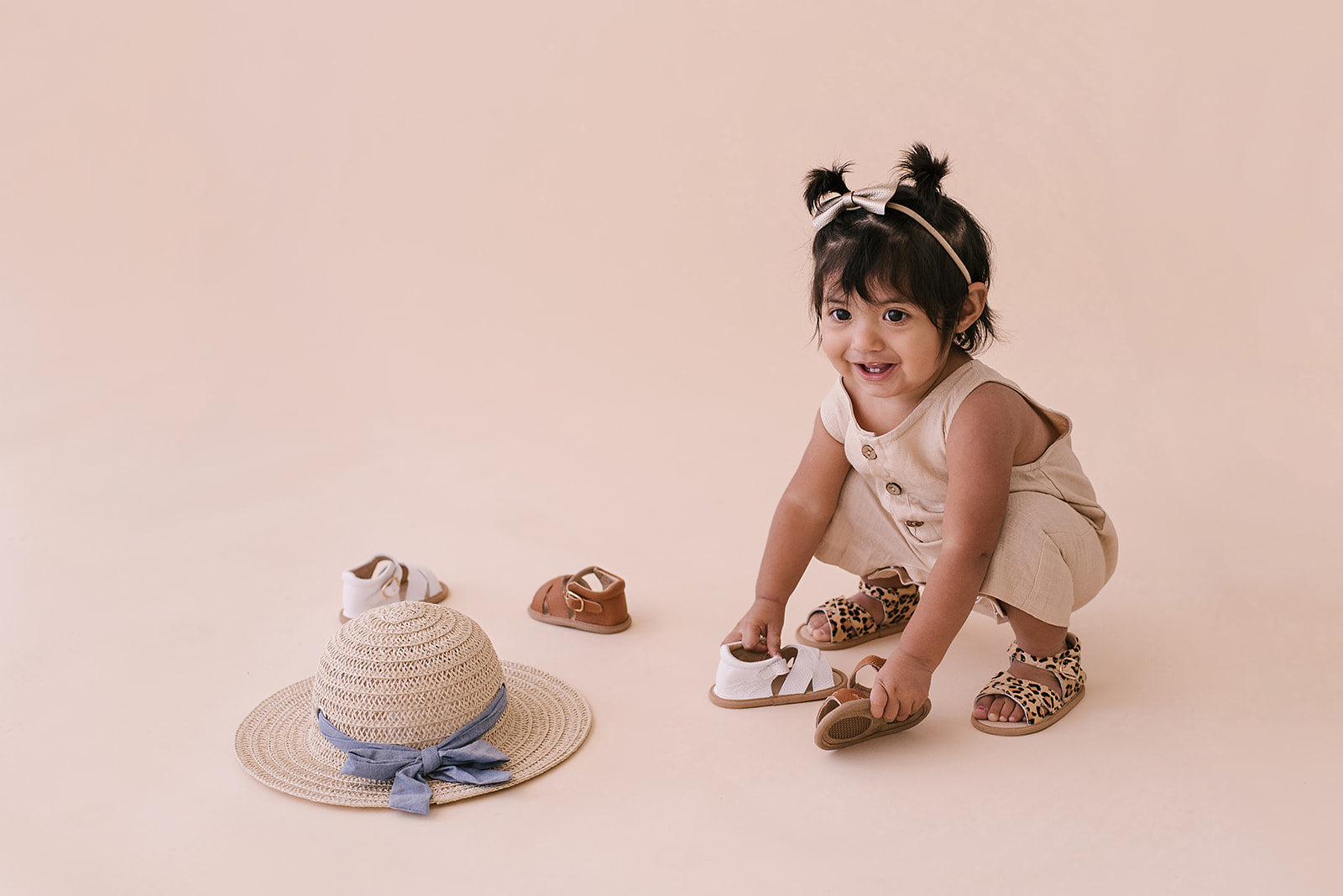 Oatmeal Cropped Linen Baby Romper featuring soft linen fabric and diaper snaps, perfect for stylish summer wear.