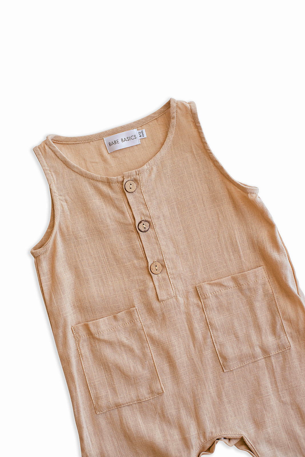 Oatmeal Cropped Linen Baby Romper featuring soft linen fabric and diaper snaps, perfect for stylish summer wear.