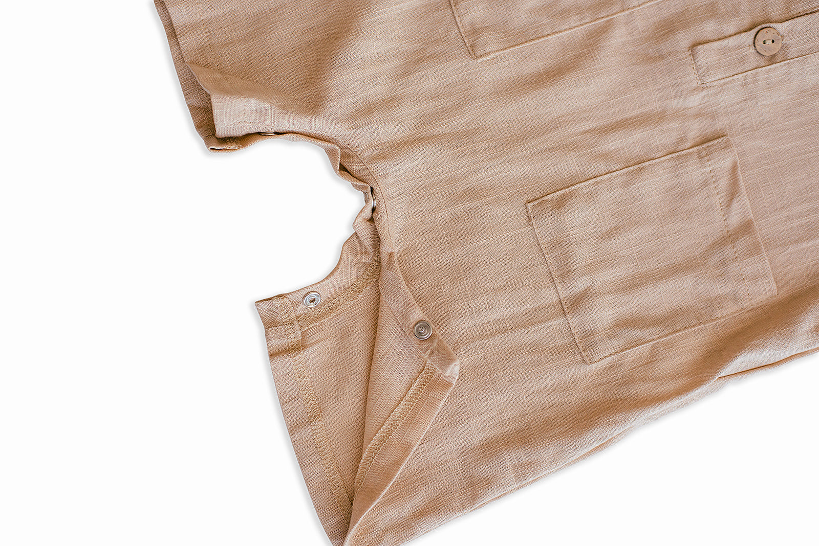 Oatmeal Cropped Linen Baby Romper featuring soft linen fabric and diaper snaps, perfect for stylish summer wear.