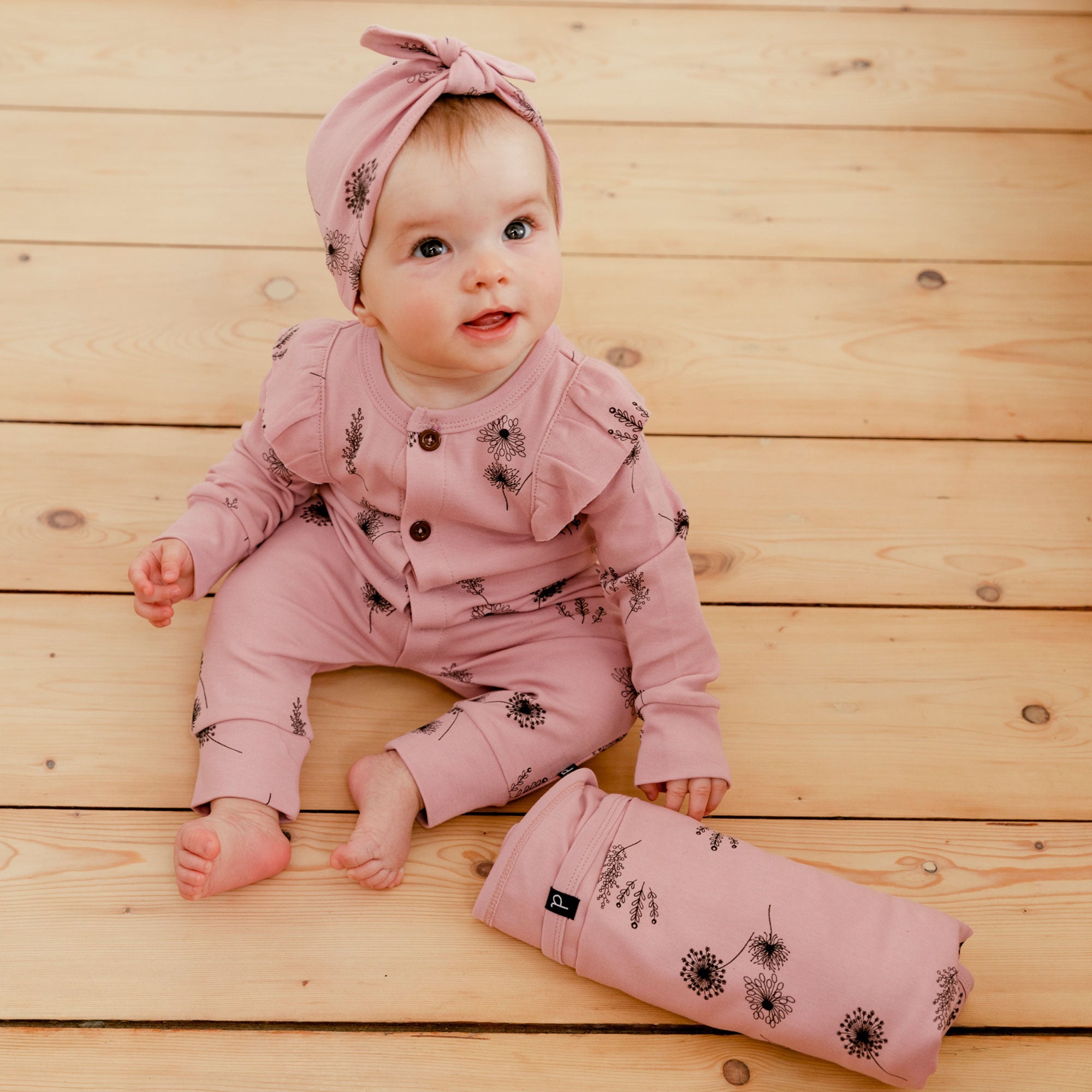 Organic Cotton Hat and Bib Set in Dusty Purple with flower print and bow detail, perfect for babies.