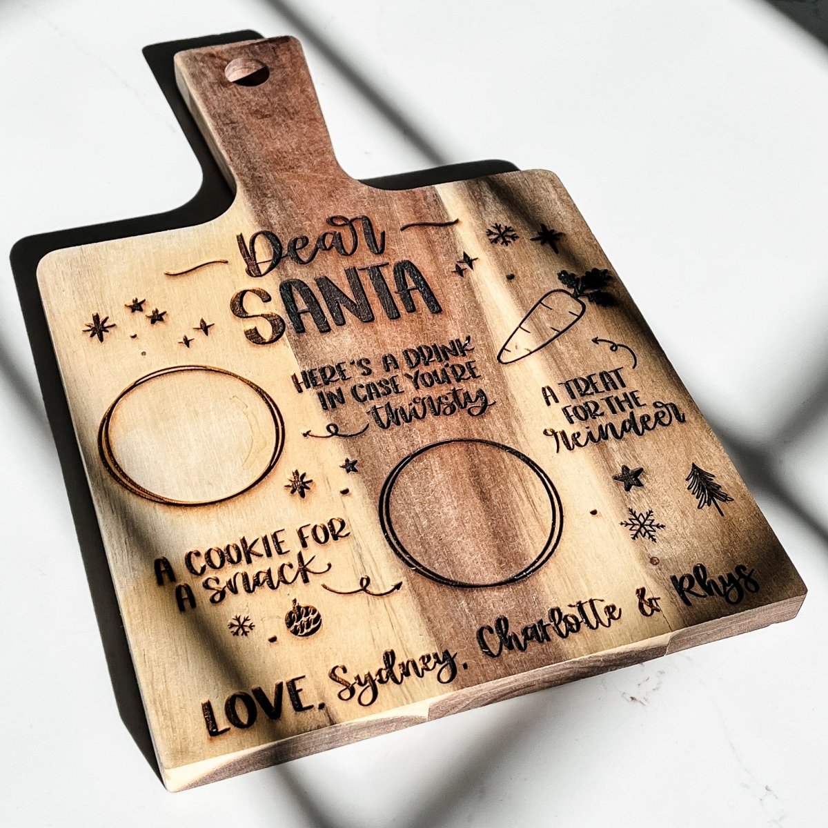 Personalized wood Santa tray cutting board with custom engraving, perfect for holiday treats and baking.