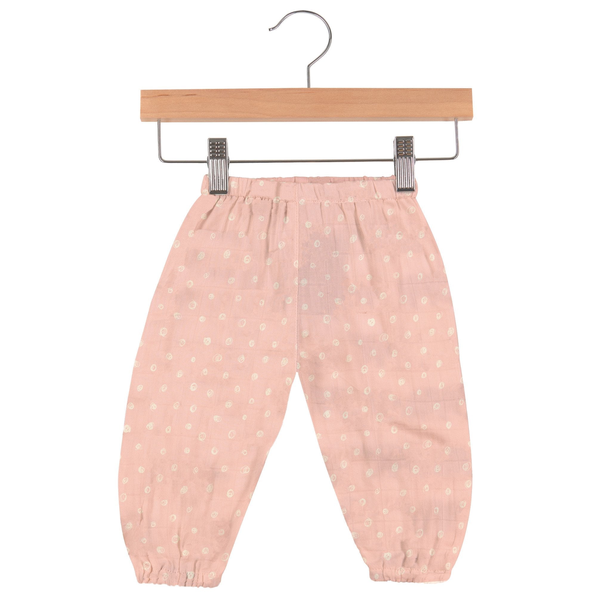 Pink Pearl Polka Dot Newcastle Mini Pants made from soft bamboo muslin, featuring an elastic waist and a loose fit for baby comfort.