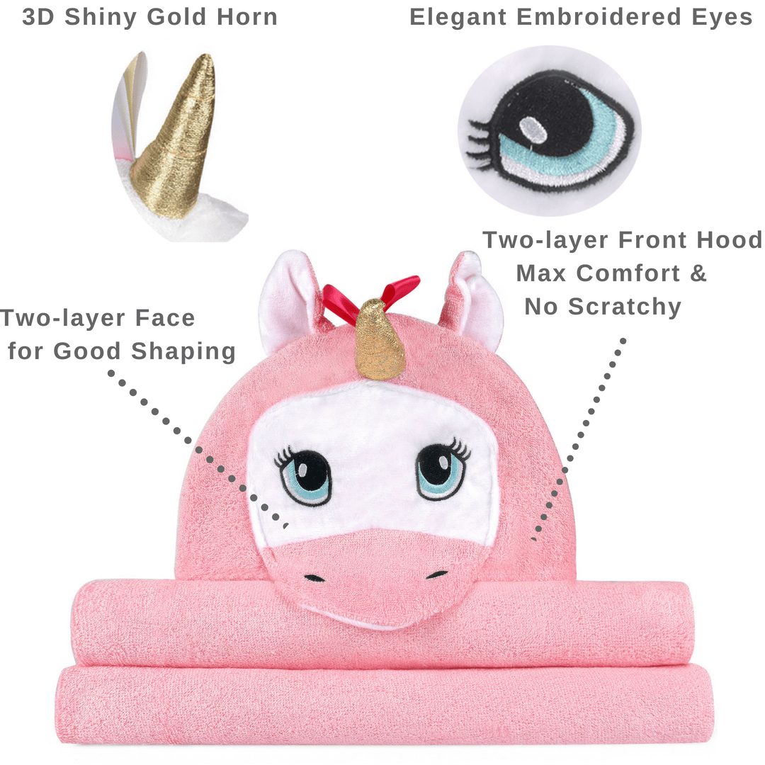 A soft and plush pink unicorn hooded towel designed for babies, featuring a cute unicorn face and ears on the hood.