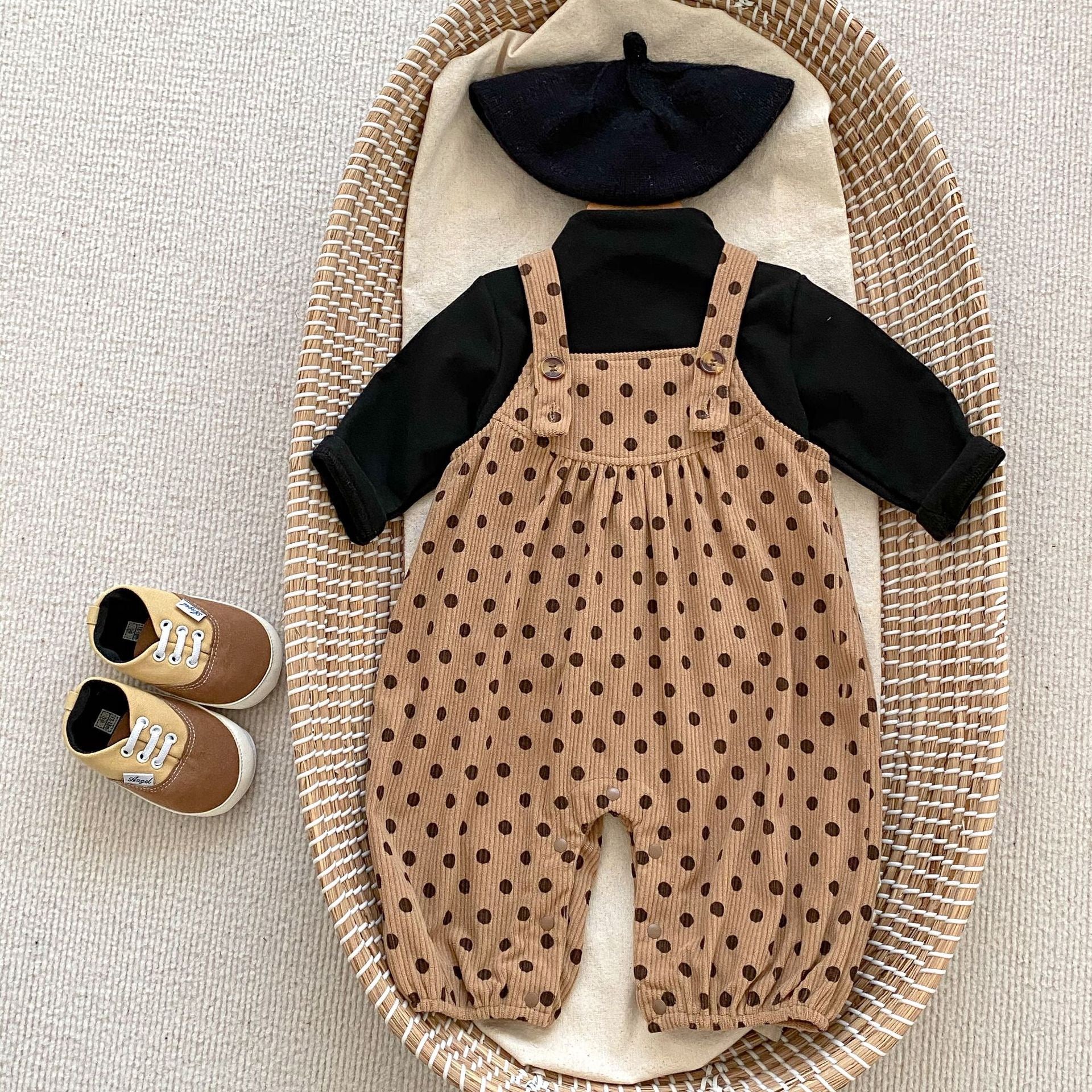 A set of polka dot overalls paired with solid color shirts in various colors, suitable for babies.