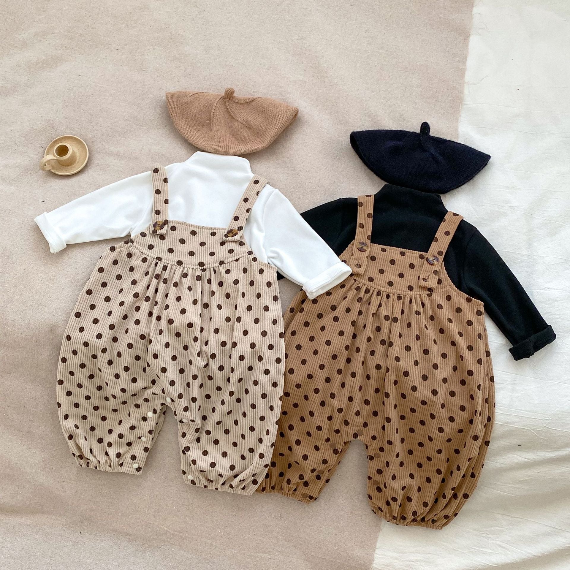 A set of polka dot overalls paired with solid color shirts in various colors, suitable for babies.