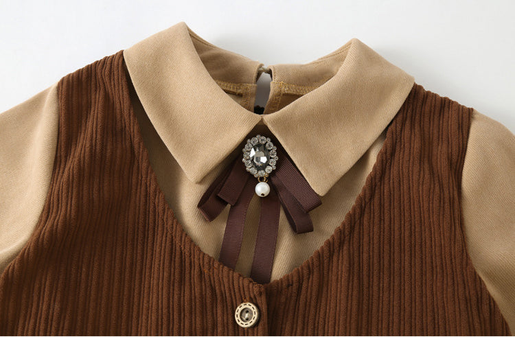 A stylish brown corduroy dress with long sleeves and a turndown collar, perfect for winter wear for girls aged 5-12.