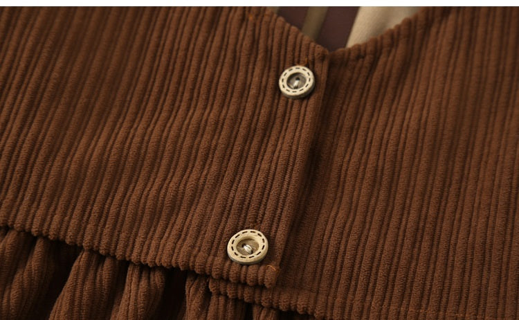 A stylish brown corduroy dress with long sleeves and a turndown collar, perfect for winter wear for girls aged 5-12.