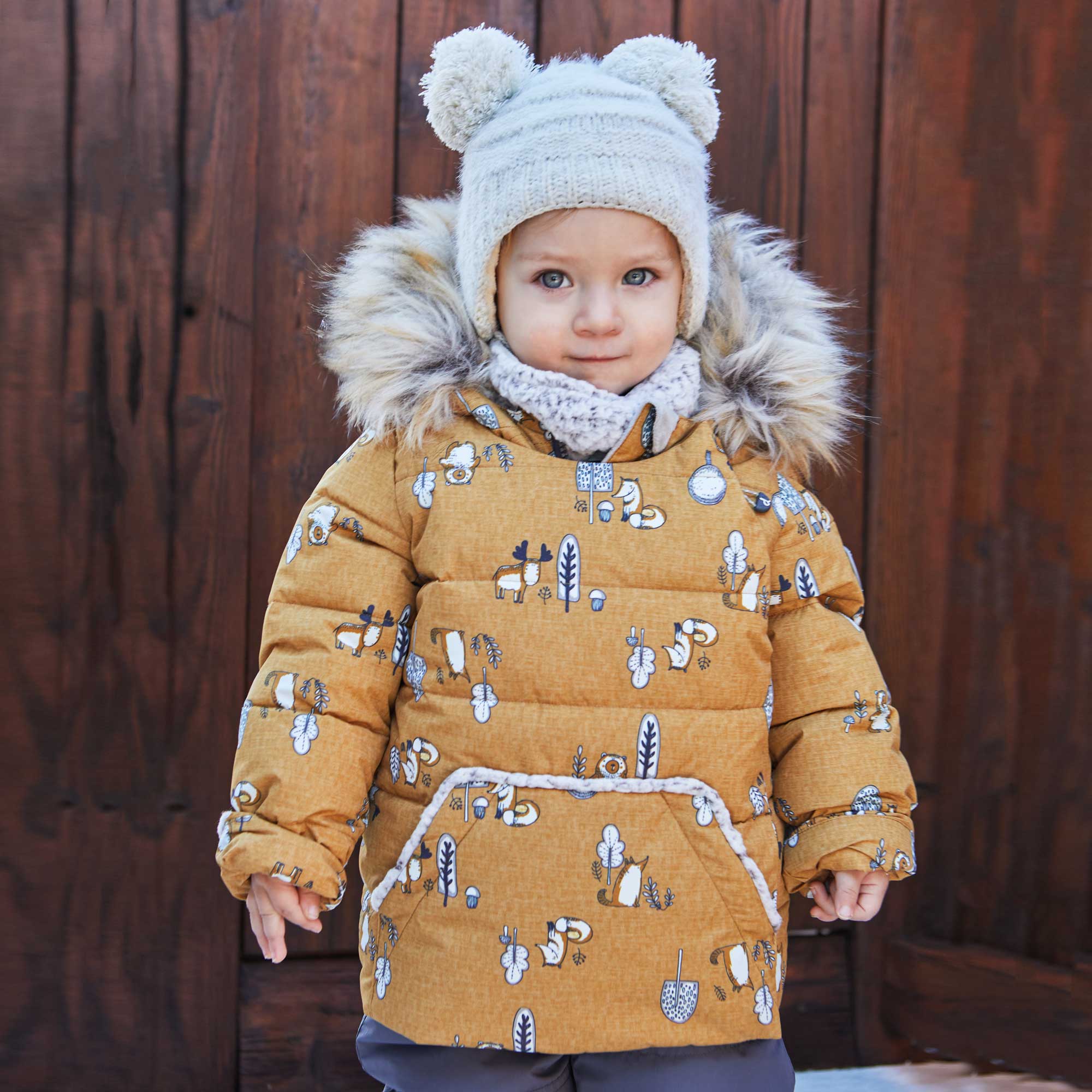 A vibrant yellow two-piece baby snowsuit featuring woodland animal prints, with a fleece-lined jacket and solid pants, perfect for winter wear.