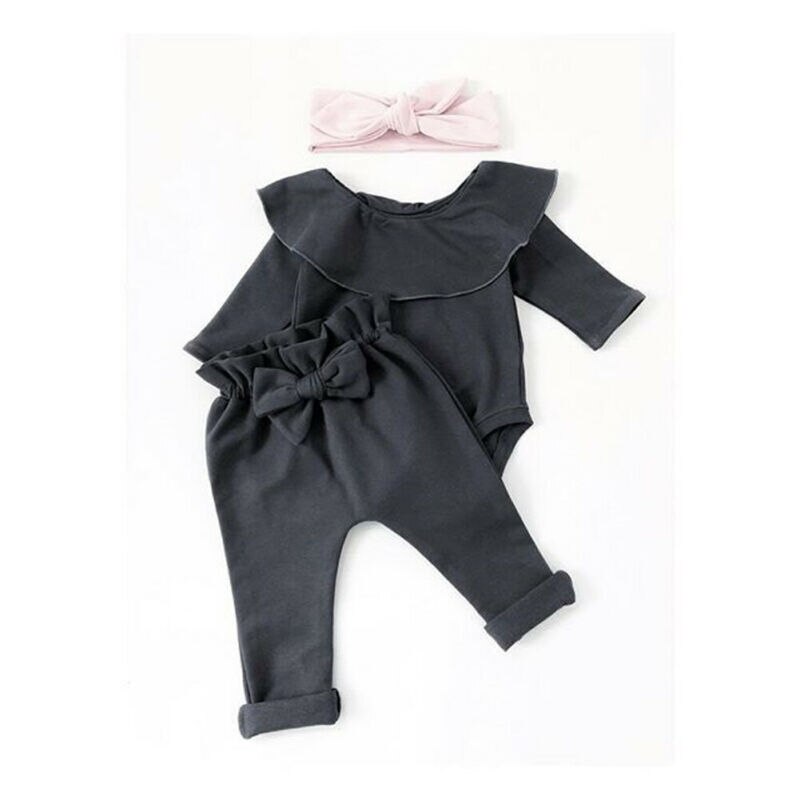 Black infant outfit with headband.