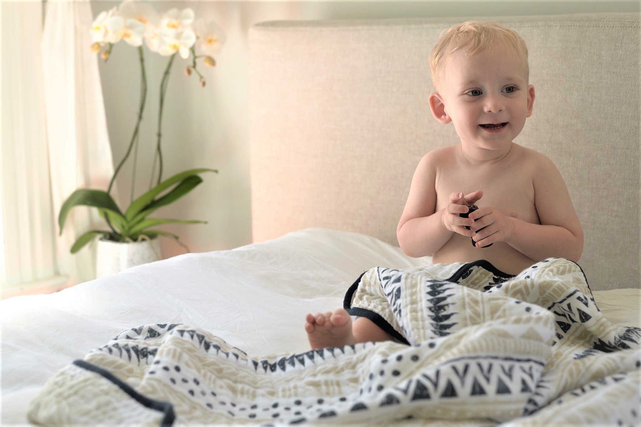 Pyramid and Boho Fields Cotton Muslin Newcastle Blanket featuring vibrant patterns and soft texture, perfect for kids.