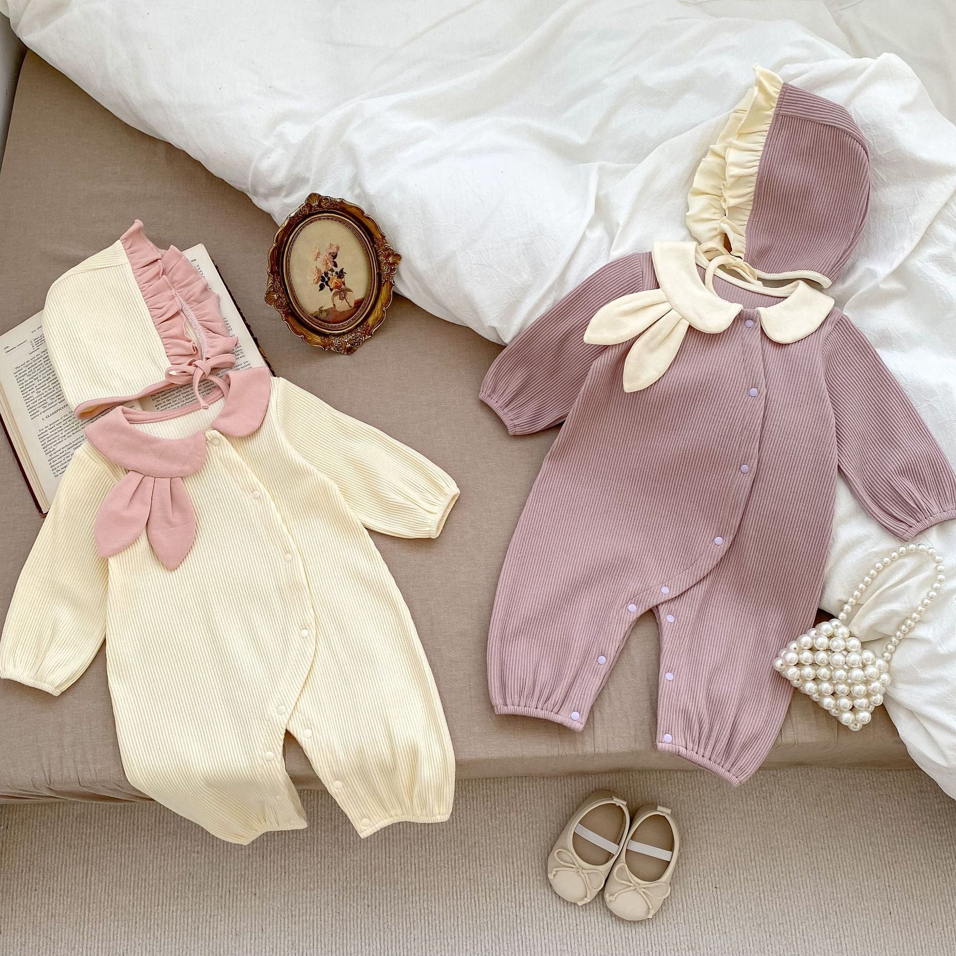 Adorable baby girl wearing a Rabbit Design Lapel Autumn Romper in purple, showcasing its cute rabbit motif and stylish lapel.