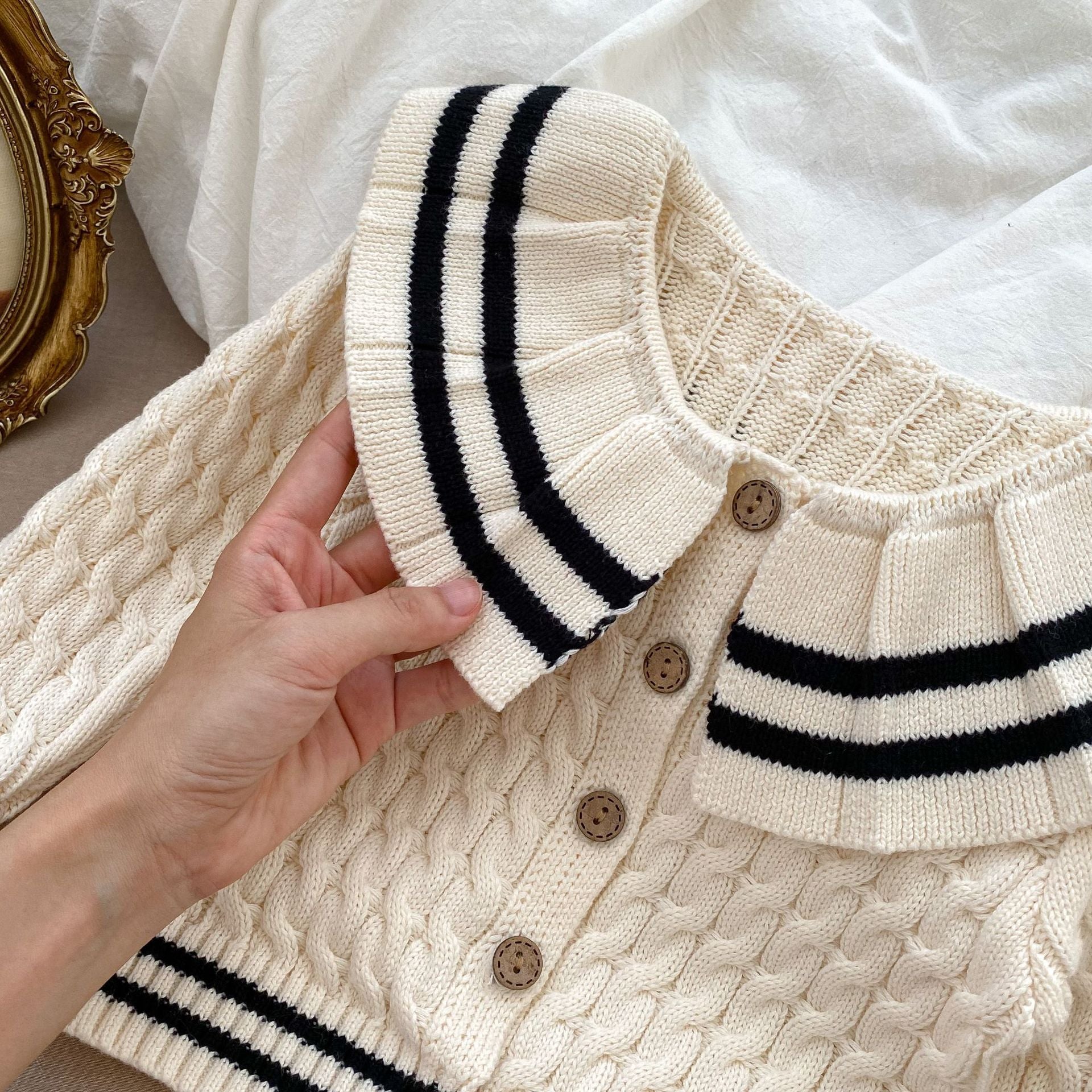 A beige knitted clothing set for girls featuring a sailor collar and striped pattern, perfect for spring and autumn wear.