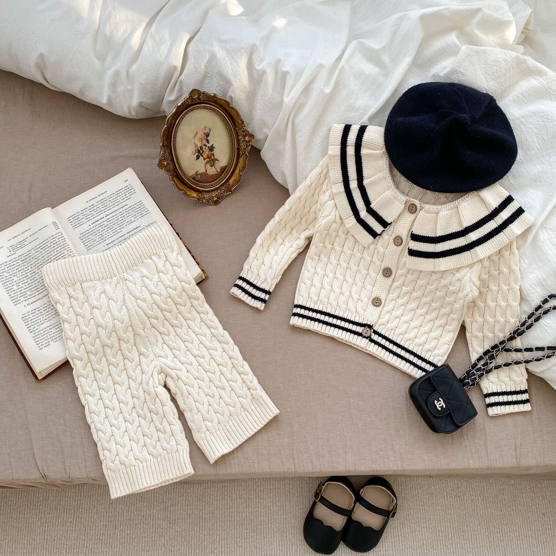 A beige knitted clothing set for girls featuring a sailor collar and striped pattern, perfect for spring and autumn wear.