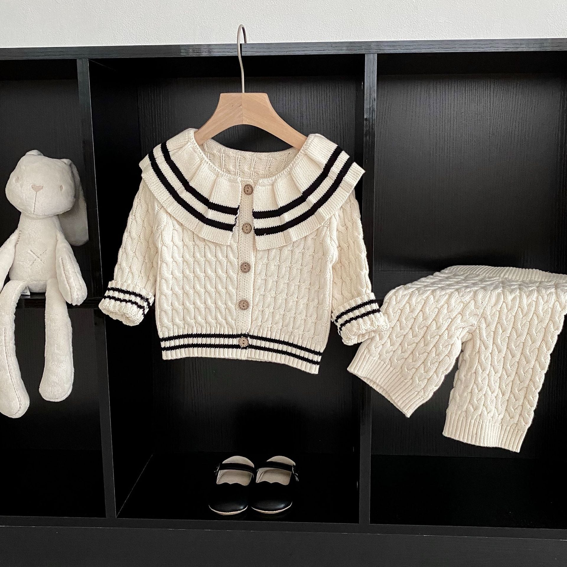 A beige knitted clothing set for girls featuring a sailor collar and striped pattern, perfect for spring and autumn wear.