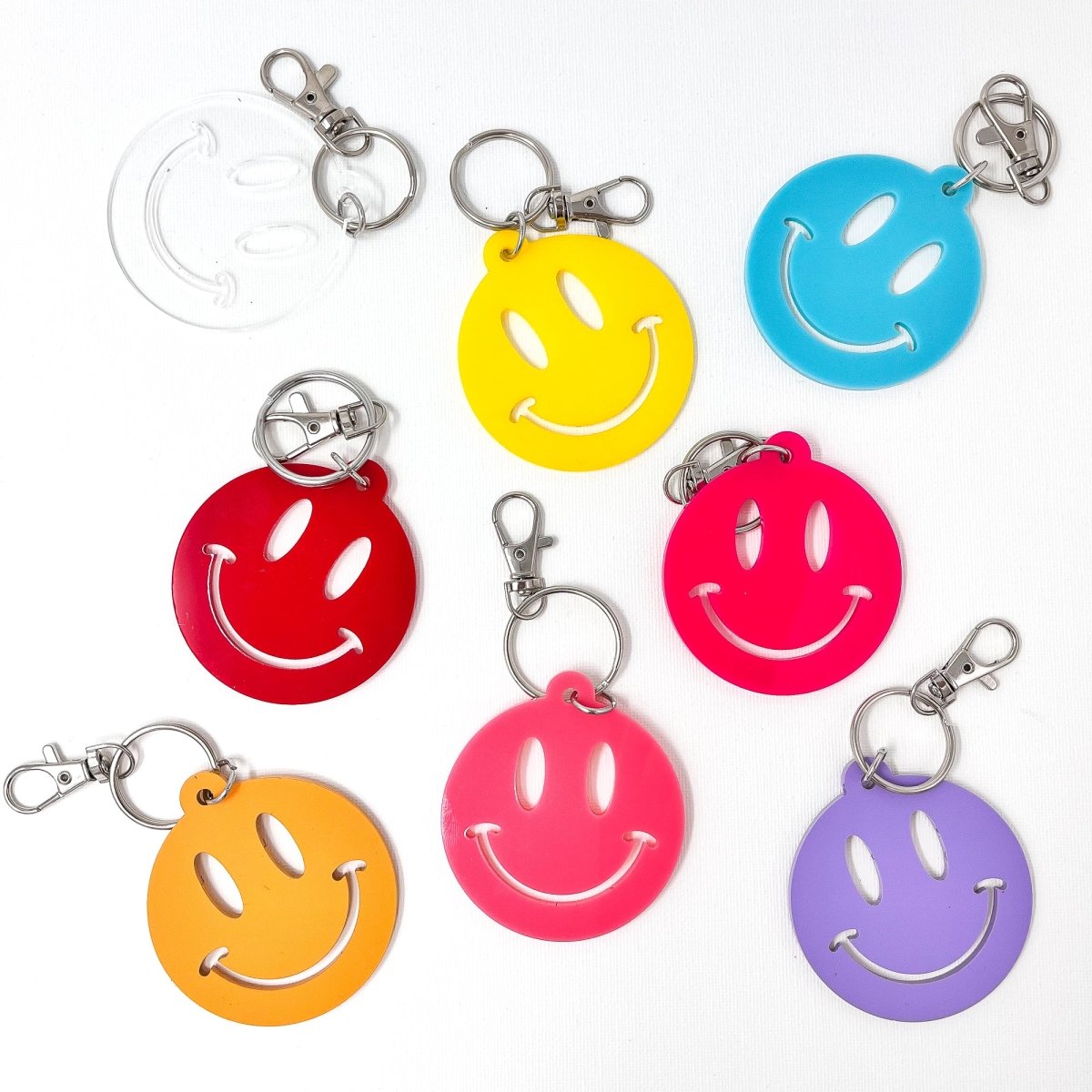 Colorful Smiley Face Keychain made of acrylic, featuring a cheerful smiley design, perfect for adding joy to your keys or bags.