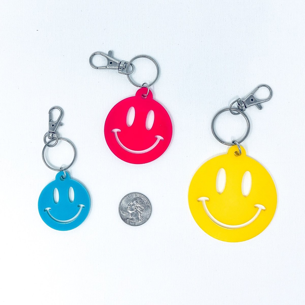 Colorful Smiley Face Keychain made of acrylic, featuring a cheerful smiley design, perfect for adding joy to your keys or bags.