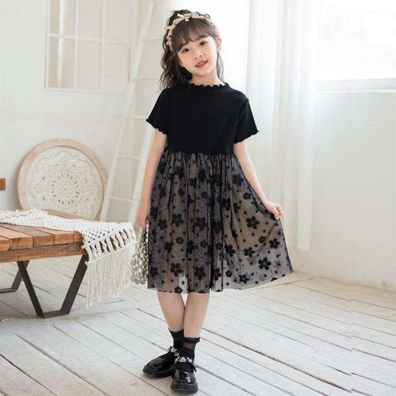 A stylish solid black short sleeve mesh dress for girls, perfect for summer wear, made from soft cotton material.