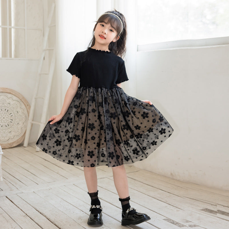 A stylish solid black short sleeve mesh dress for girls, perfect for summer wear, made from soft cotton material.