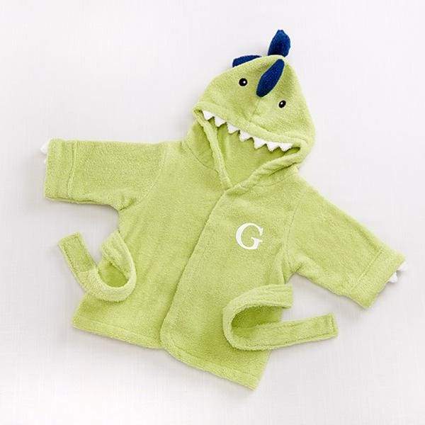 A cozy Jurassic-green dinosaur hooded spa robe for babies, featuring embroidered black eyes, 3-D spikes, and pearly-white terry teeth.