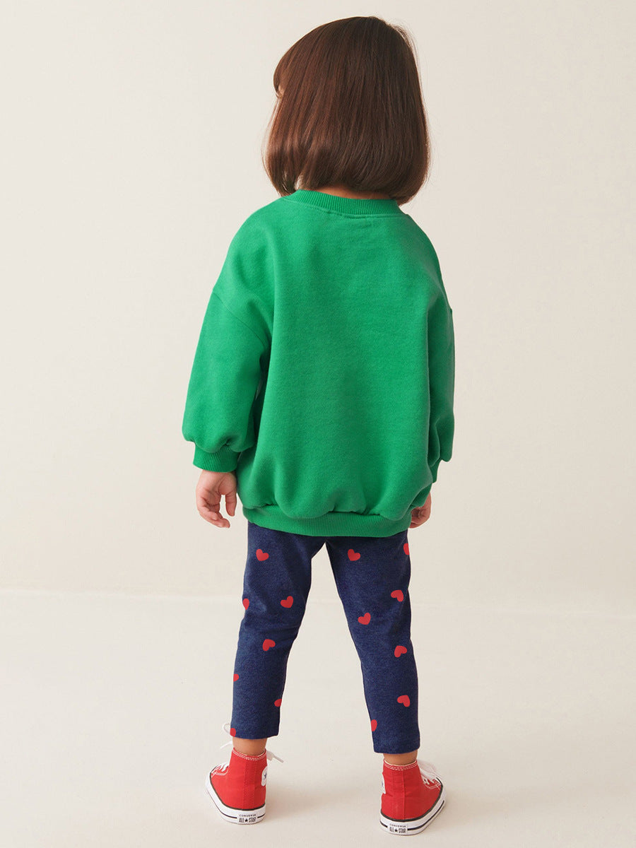 A green long sleeves top for girls featuring cute cartoon animal patterns, perfect for spring and autumn wear.