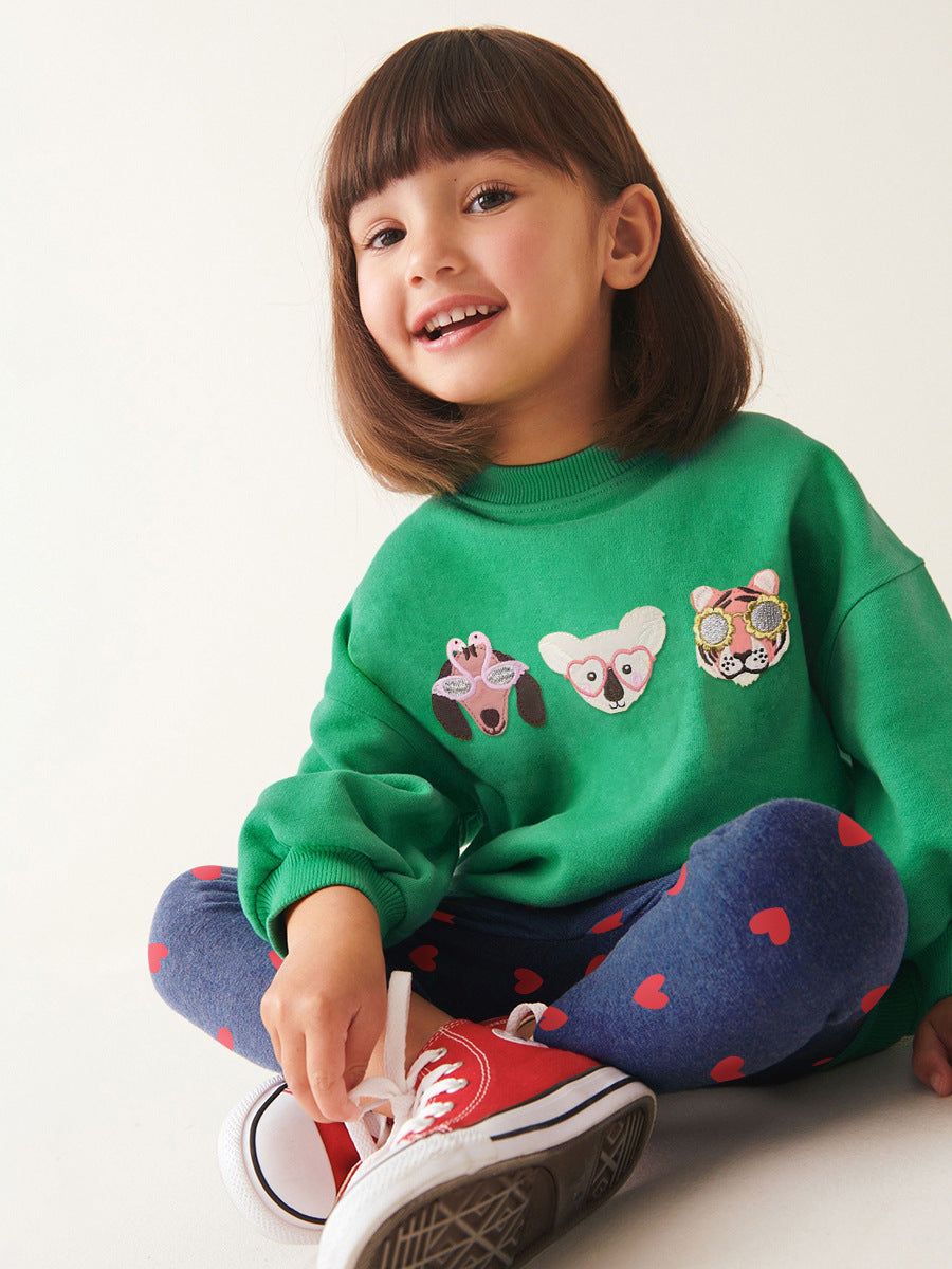 A green long sleeves top for girls featuring cute cartoon animal patterns, perfect for spring and autumn wear.