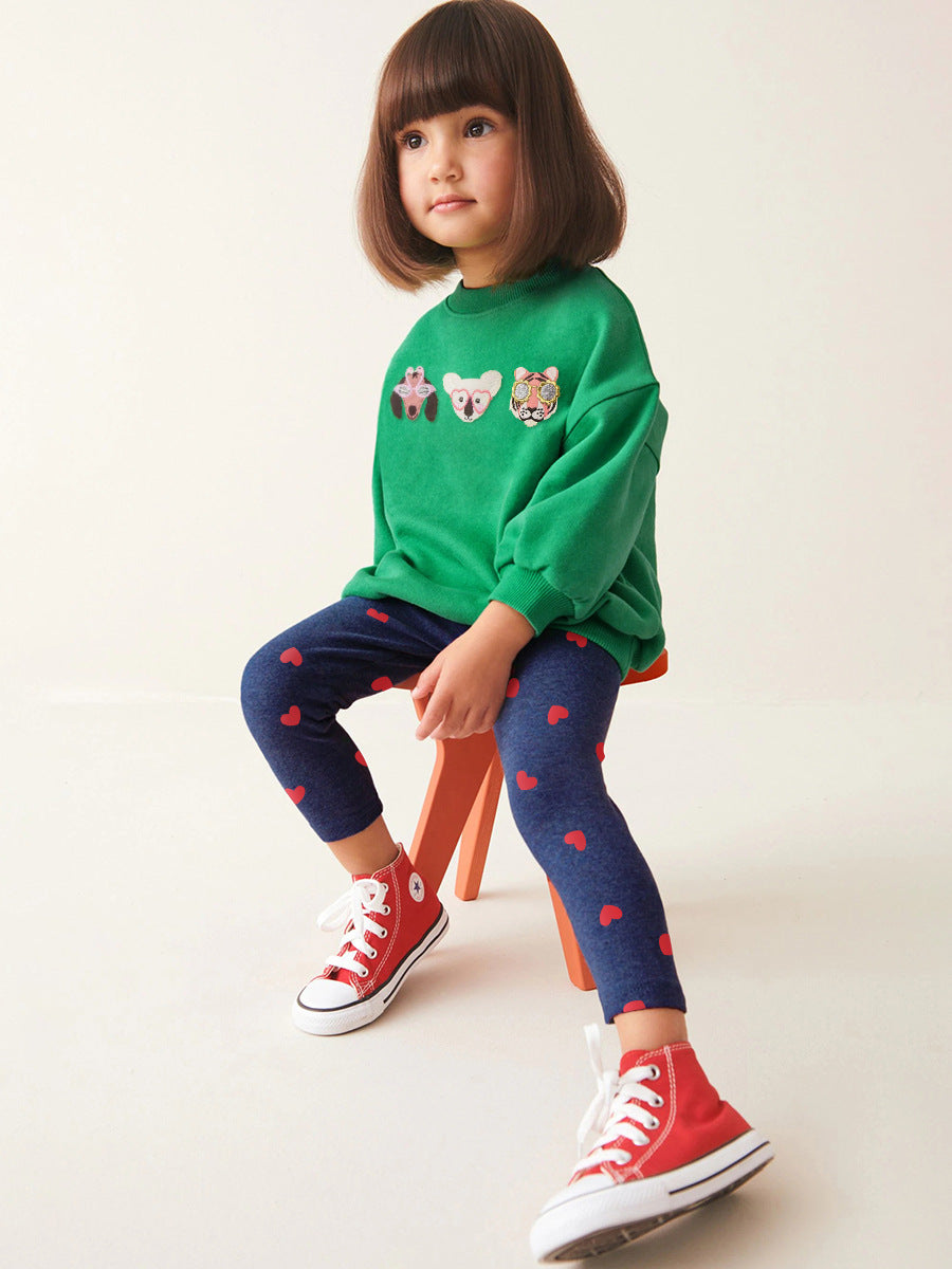 A green long sleeves top for girls featuring cute cartoon animal patterns, perfect for spring and autumn wear.