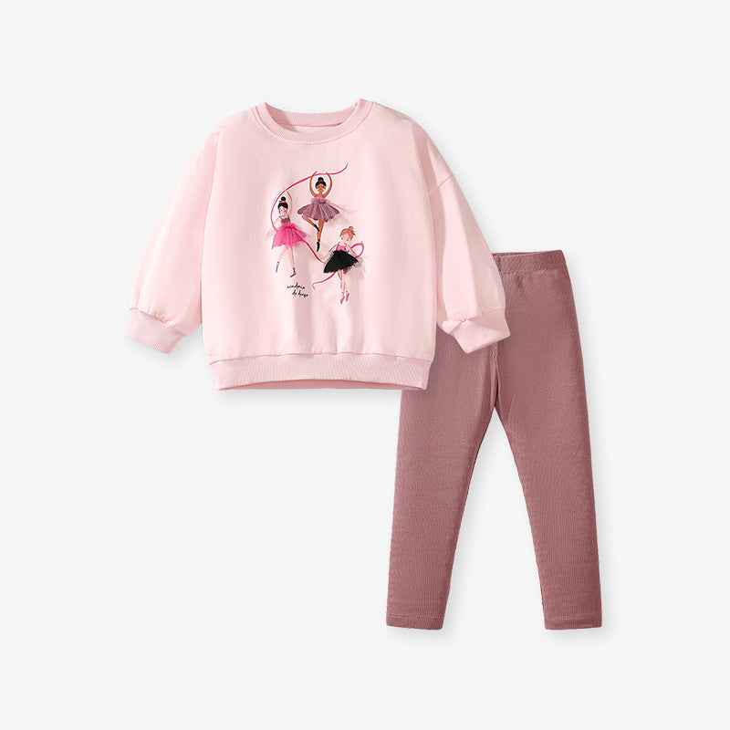 A pink long sleeve crew neck top featuring a cartoon dancer pattern, designed for girls aged 12 months to 10 years.